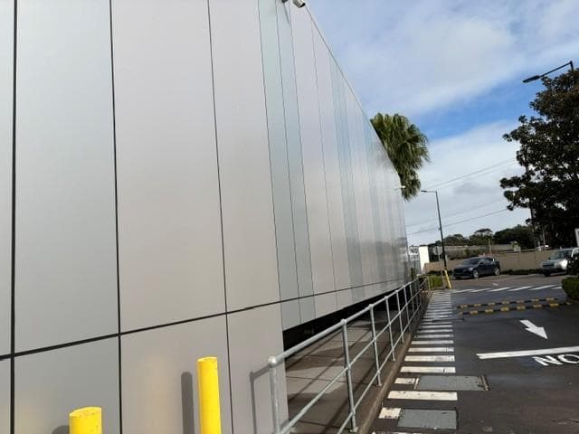 Close perspective of ALPOLIC™ metallic panels along the pedestrian walkway