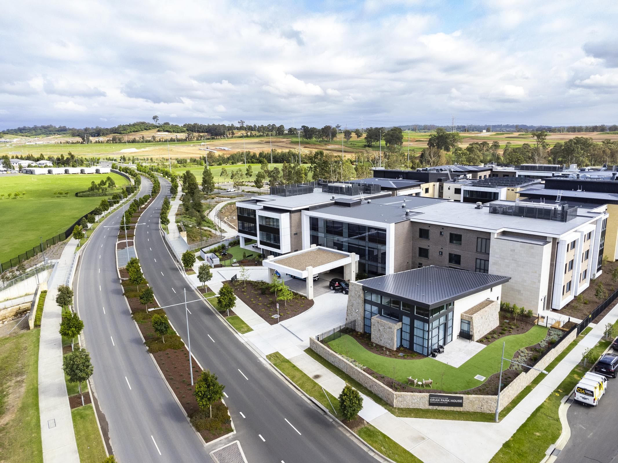 Aerial view of Oran Park House showing ALPOLIC™ NC/A1 cladding integrated across the multi-storey façades