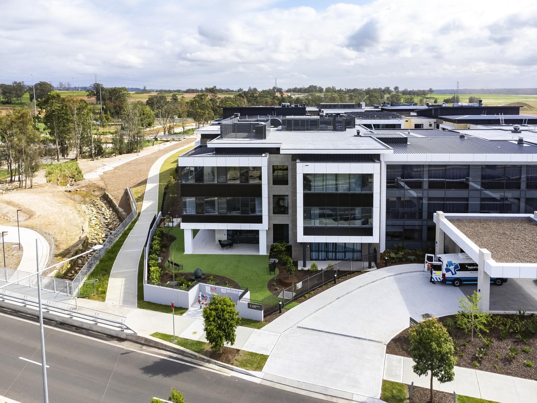 Aerial view of Oran Park House entrance and façade featuring ALPOLIC™ NC/A1 cladding in contrasting finishes