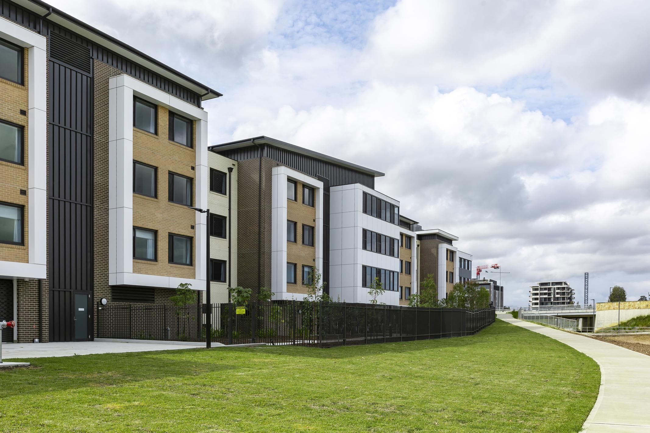 Side elevation of Oran Park House with ALPOLIC™ NC/A1 cladding complementing brick and metal façade finishes