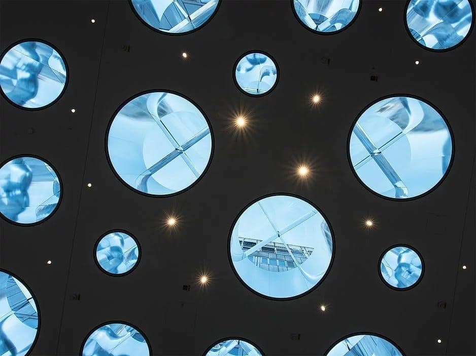 Interior passage at Blue Hospital illuminated by durlum daylight ceiling system with anodised aluminium light pipes