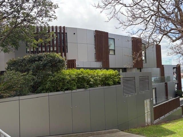Breeze Apartments in Drummoyne with ALPOLIC™ NC/A1 metallic façade cladding framed by landscaping