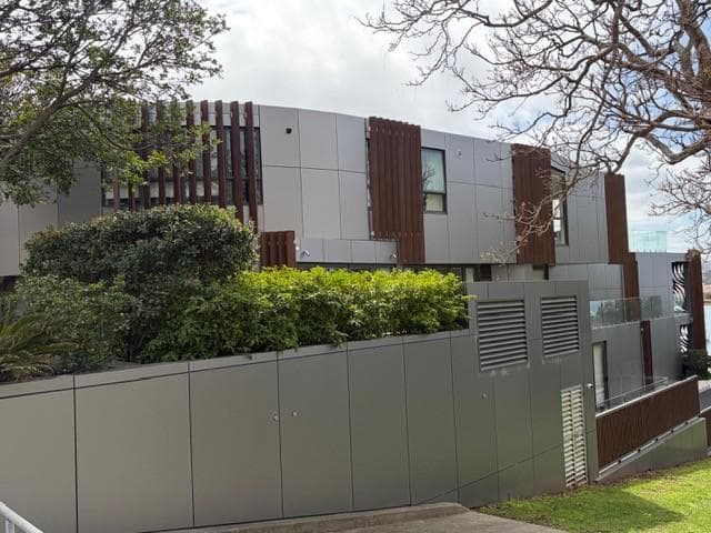 Breeze Apartments in Drummoyne with ALPOLIC™ NC/A1 metallic façade cladding framed by landscaping