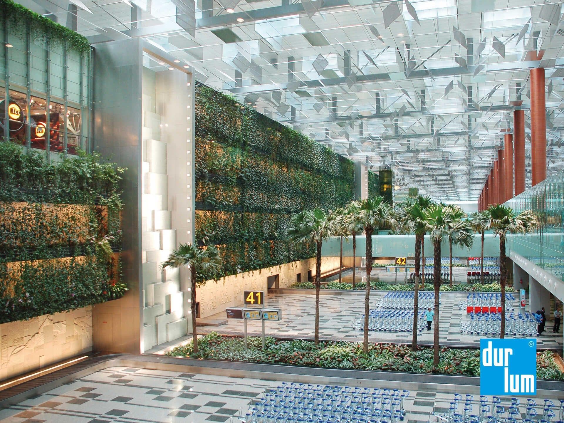durlum ceiling system with integrated lighting creating calm passenger spaces at Changi Airport Terminal 3