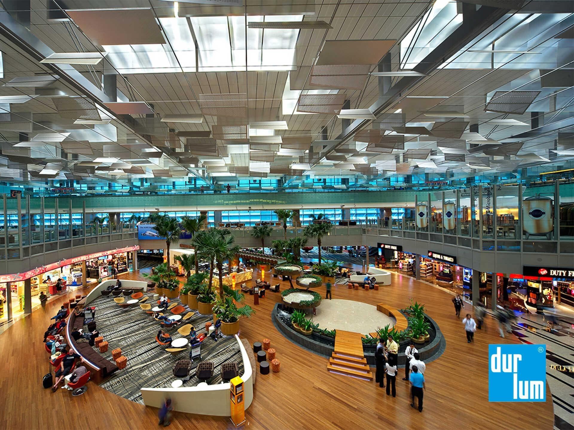 durlum ceiling integrating daylight, artificial lighting and services across airport terminal interior