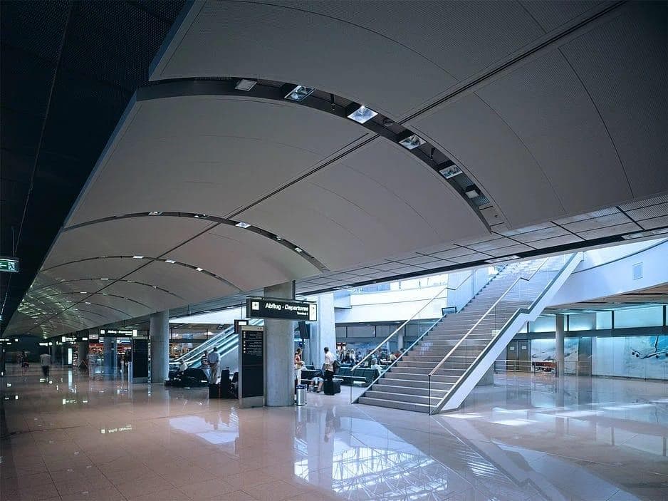 Durlum DOMUS curved metal ceiling panels at Hamburg Airport in Germany.