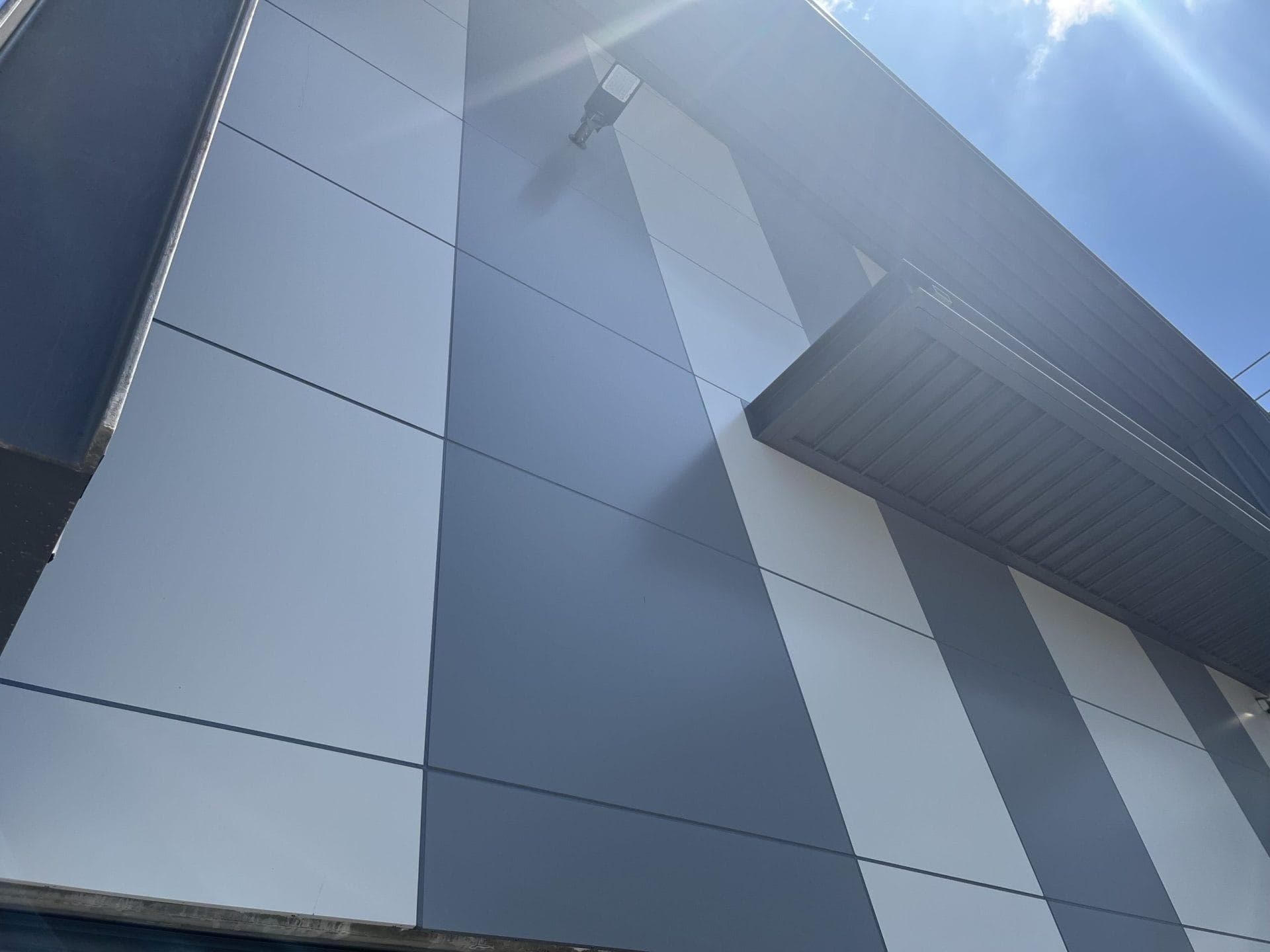 Close-up of ALPOLIC™ NC Aluminium Grey and Milk White cladding panels at Orchard Hills Substation