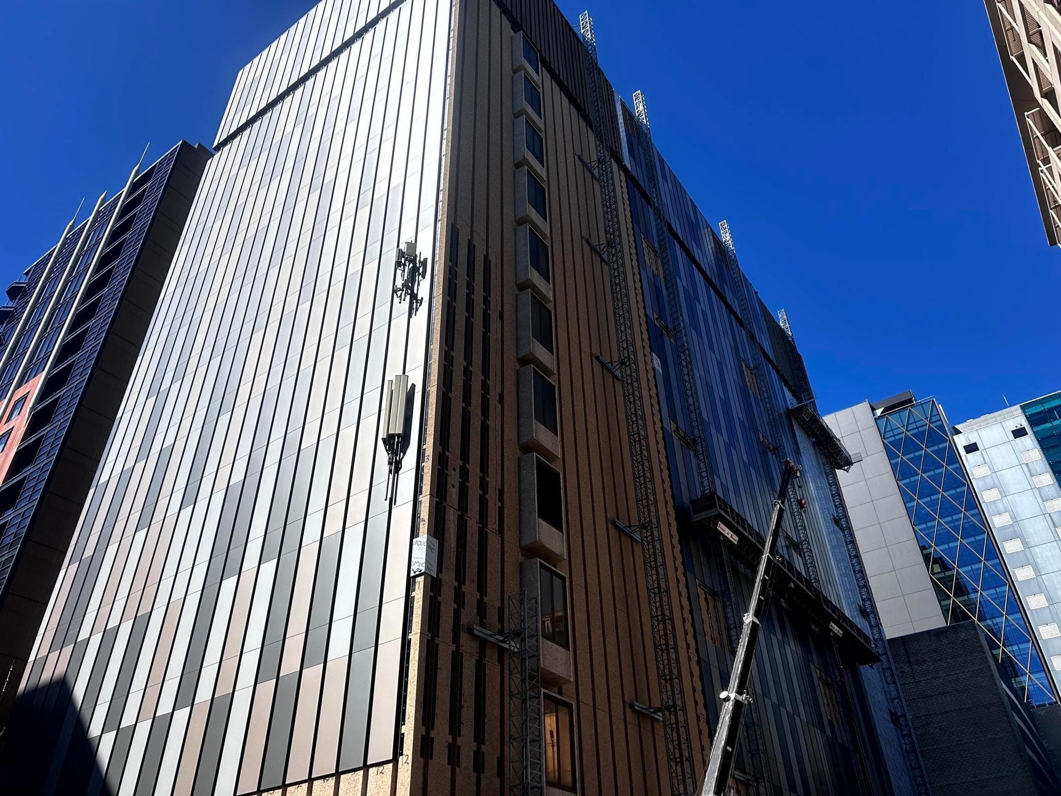 Large-scale ALPOLIC™ NC/A1 recladding of Telstra Waymouth data exchange showing multi-tonal metallic panels