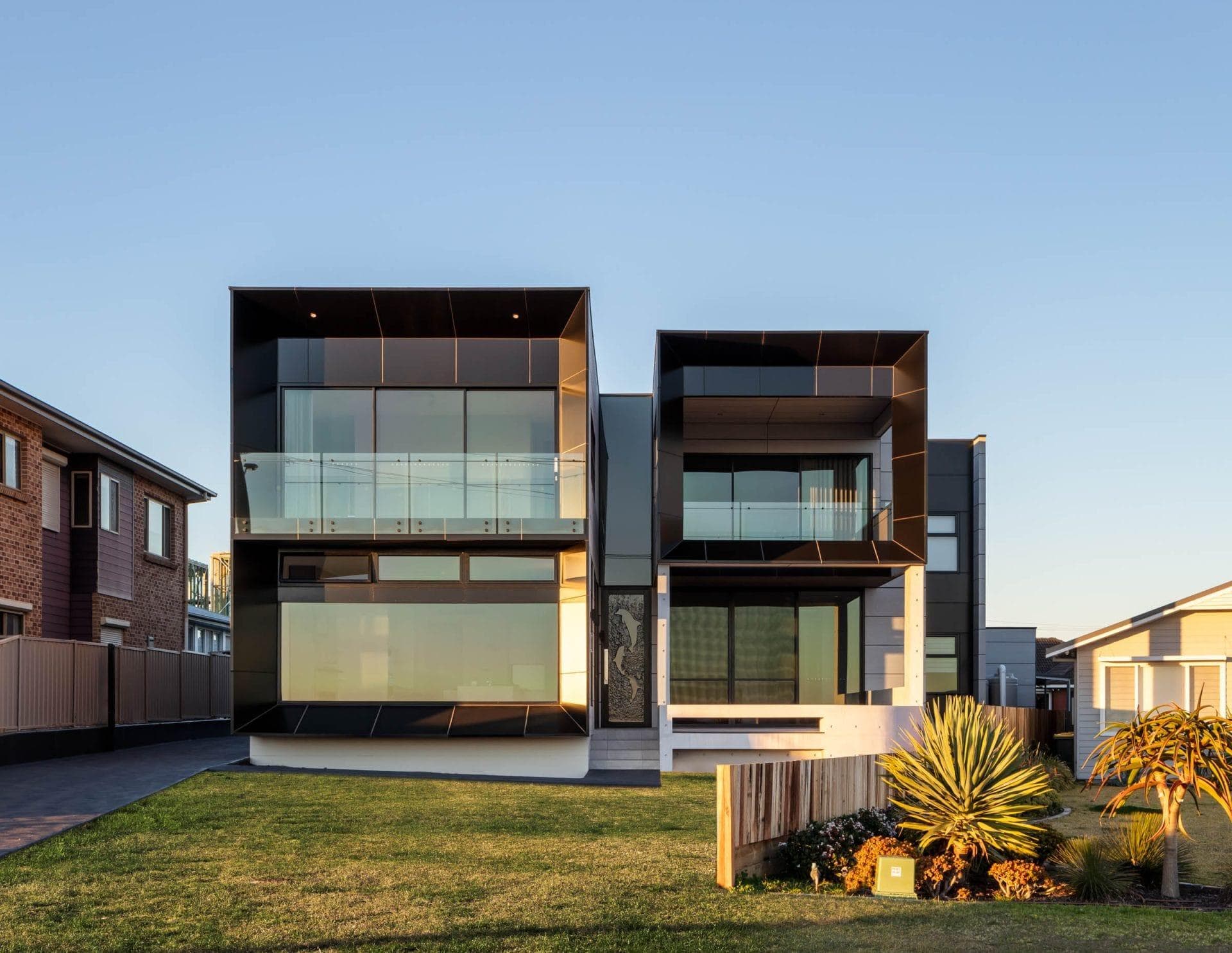 Front elevation of The Icon residence featuring ALPOLIC™/fr Monotone Slate cladding and glass balconies