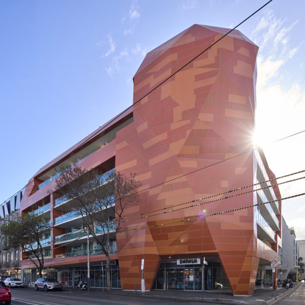 Contemporary mixed-use building with coloured cladding façade