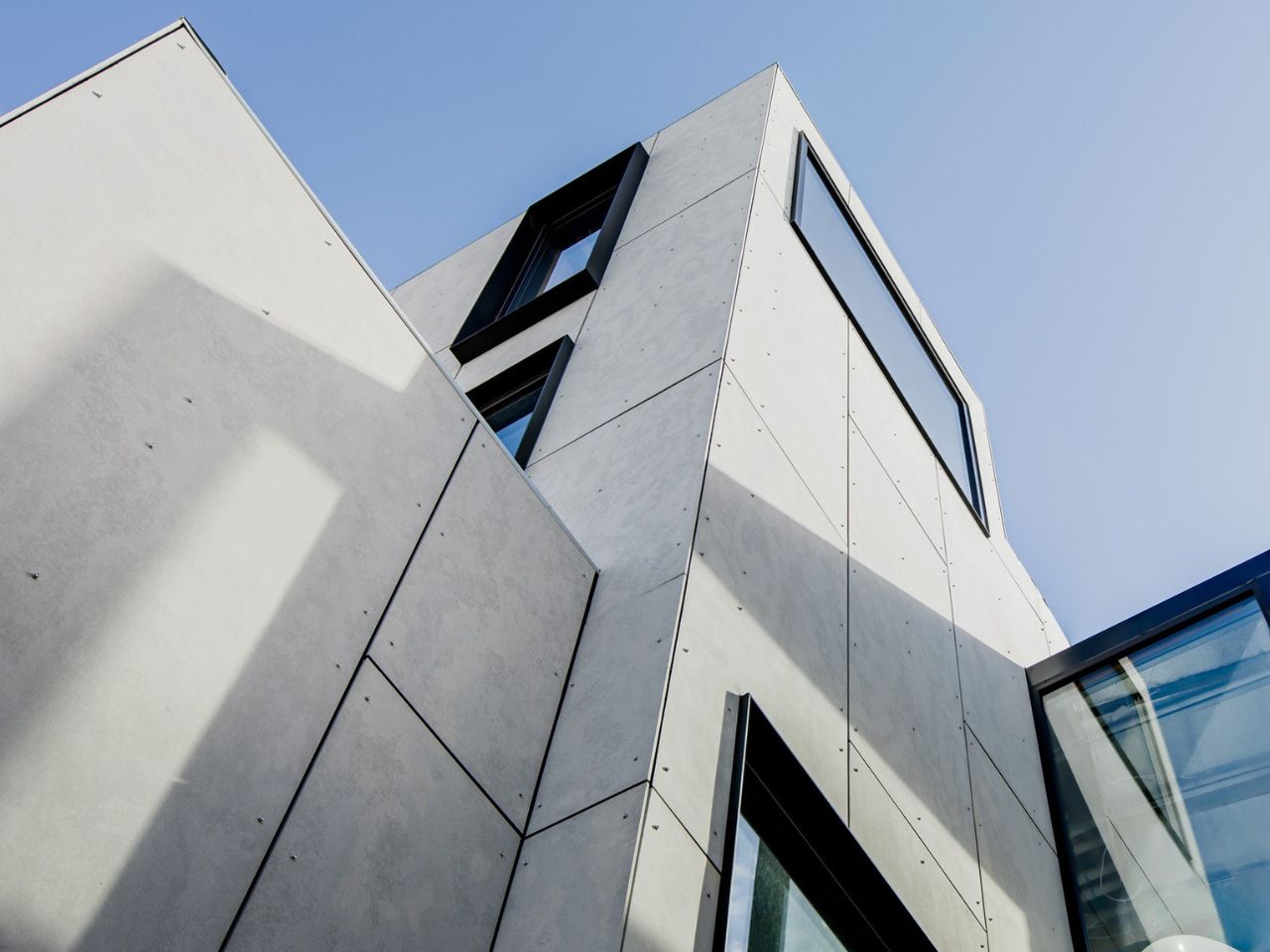 Cemintel Barestone non-combustible fibre cement façade.