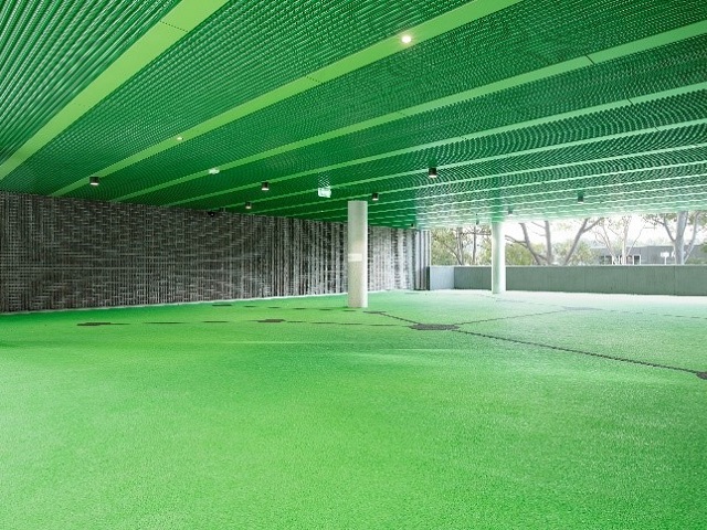 durlum bespoke perforated metal ceiling in custom vibrant green finish