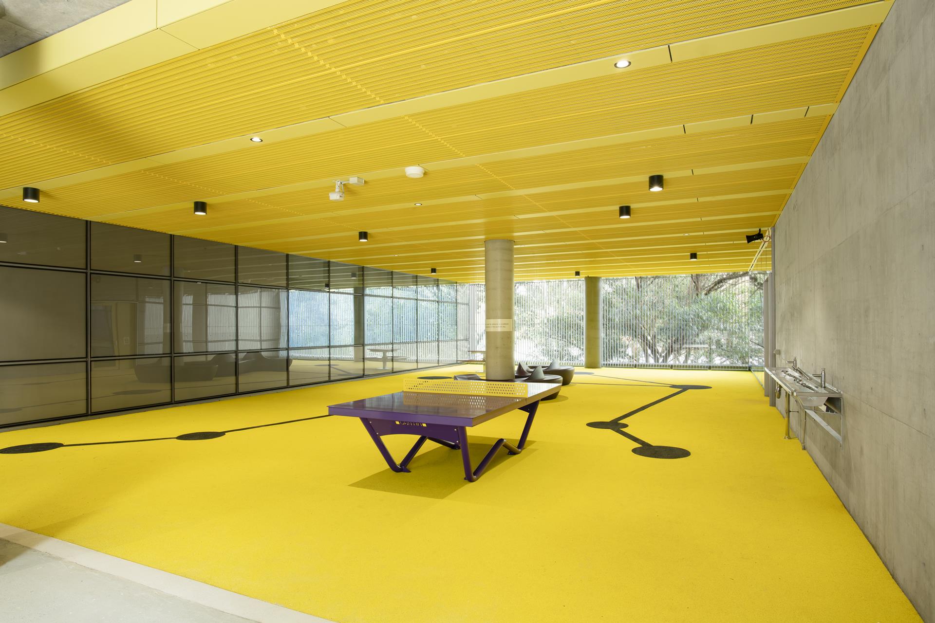 durlum bespoke metal ceilings line the covered outdoor areas, gymnasium and school hall at Meadowbank Education Precinct in Sydney