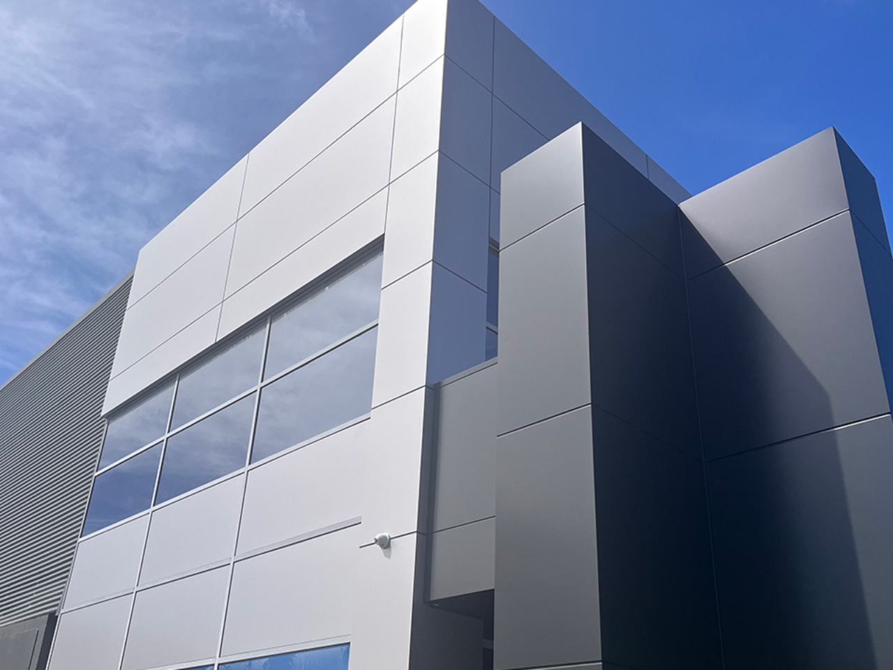 Modern façade of Fraternity Club, Wollongong, showcasing sustainable aluminium cladding.