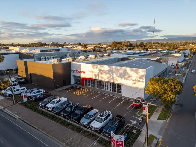 Aerial view of Jarvis Toyota dealership featuring ALPOLIC™ façade cladding and vehicle display area