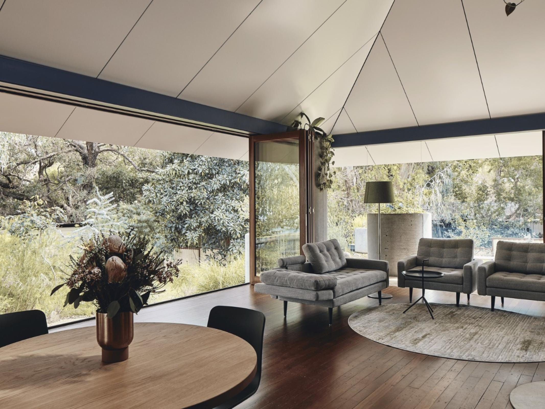 Interior living space showcasing sustainable design connected to exterior architecture using ALPOLIC™ cladding on the ceiling
